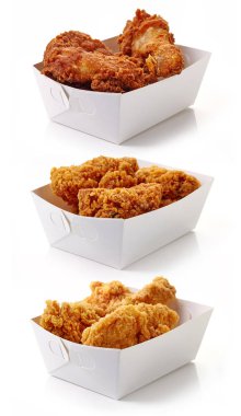 Fried breaded chicken fillet in white cardboard boxes clipart