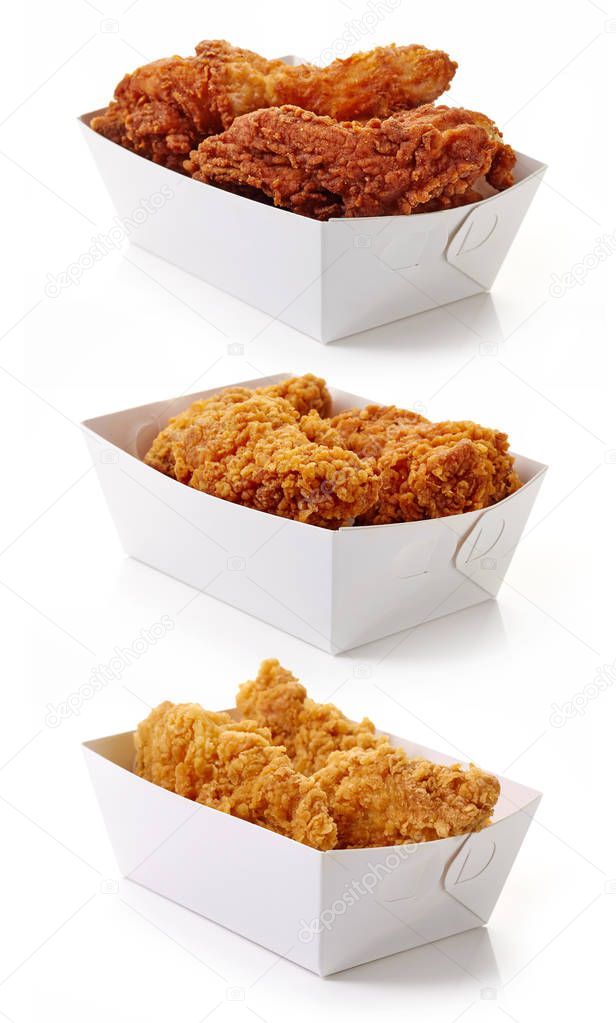 Fried breaded chicken fillet in white cardboard boxes