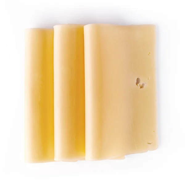 Kaas plakjes geïsoleerd op wit, van bovenaf — Stockfoto