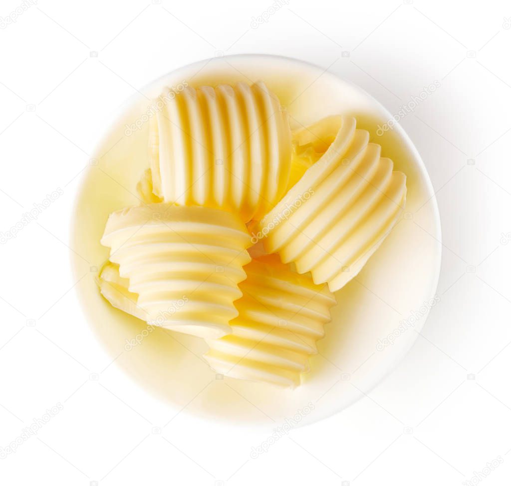 Butter curls isolated on white, from above