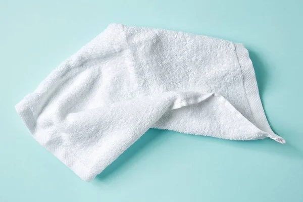 White spa towel on blue, from above — Stock Photo, Image