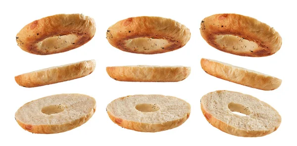 Parte Inferior Bagel Cortada Pela Metade Levitando Diferentes Posições Isoladas — Fotografia de Stock