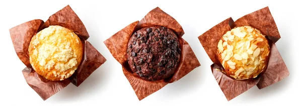 Verschiedene Muffins Braunem Papier Isoliert Auf Weißem Hintergrund Draufsicht — Stockfoto