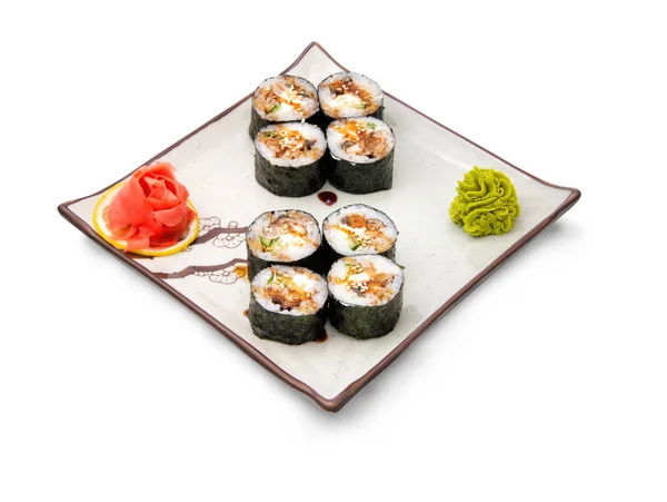 Sushi rulle med tång Stockfoto