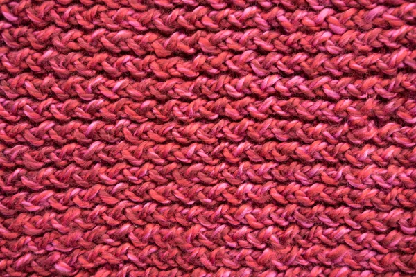 Red knitted textured background