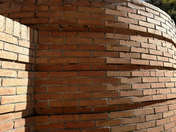 red brick round wall full sun