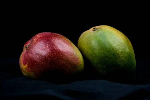 ripe red and green mangoes
