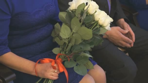 Father and mother sitting in the registry office — Stock Video