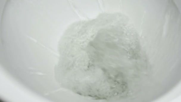 Cleaning of the toilet bowl using the water stream — Stock Video