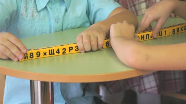 Hands of children studying numbers and letters — Stock Video