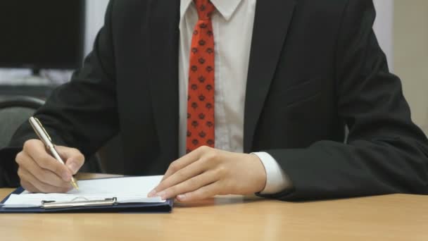 Teenager sitting at the desk indoors — Stock Video