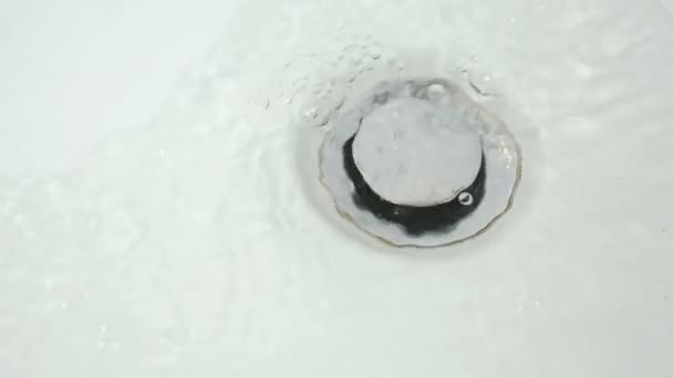 Process of draining water into sink of bathtub — Stock Video