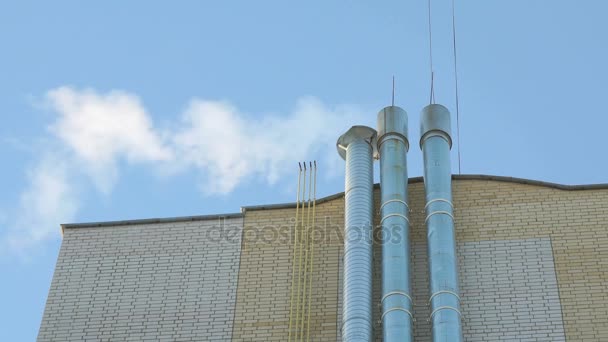 Chimney with white fume in the background blue sky — Stock Video