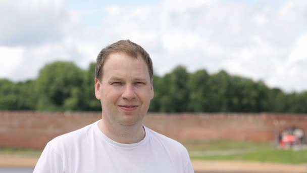 Portrait of serious young man aged 40s outdoors — Stock Video