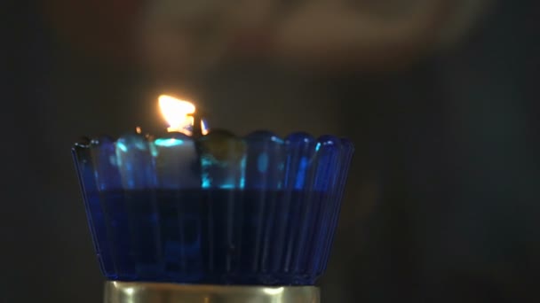 Church oil lamp with a burning candle in temple — Stock Video