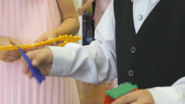 Children play in kindergarten indoors — Stock Video