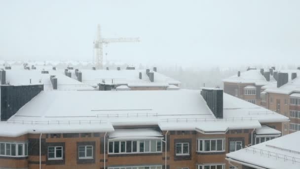 Snowfall over high rise building — Stock Video