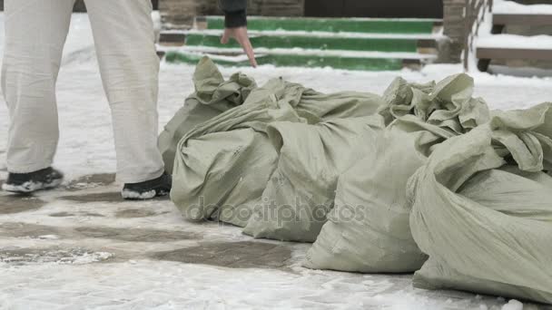 Unknown men taking bag with debris — Stock Video