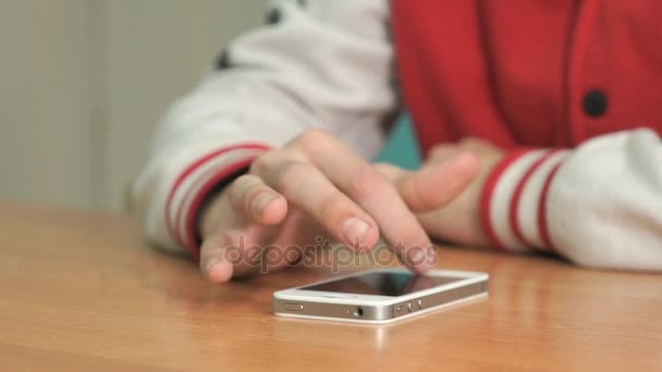 Student pressing finger on screen of smartphone — Stock Video