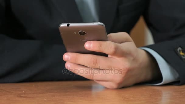 Unknown student holding grey smartphone — Stock Video