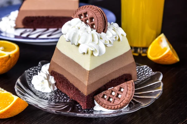 Three chocolates mousse cake slice