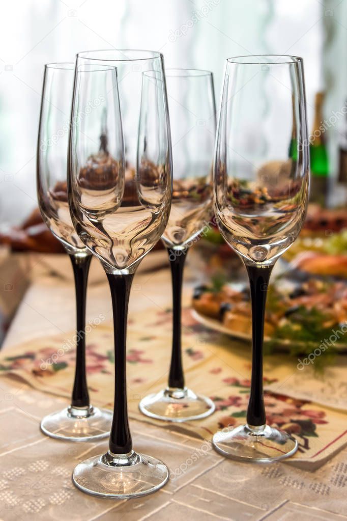 champagne glasses on festive home table 