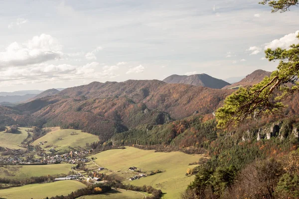 Sulov-Hradna village with partly rocky hills covered by colorful forest in Slovakia during autumn — Stock Photo, Image