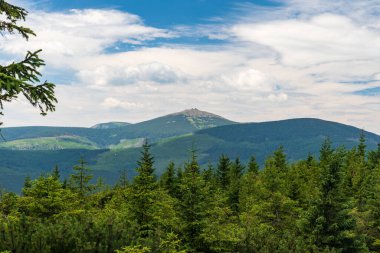 View from Lysecinska hora hill in Krkonose mountains on czech-polish borders during nice summer day clipart