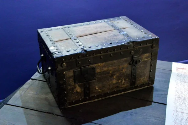 Small oak chest posing on a wooden table