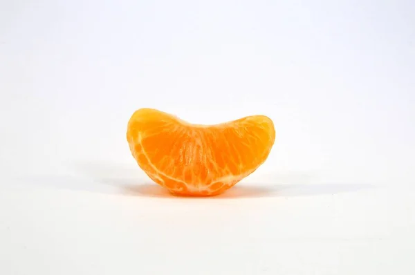 Tangerine parts on a white — Stock Photo, Image