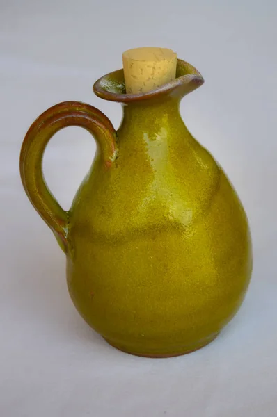 Small green terracotta pitcher with — Stock Photo, Image