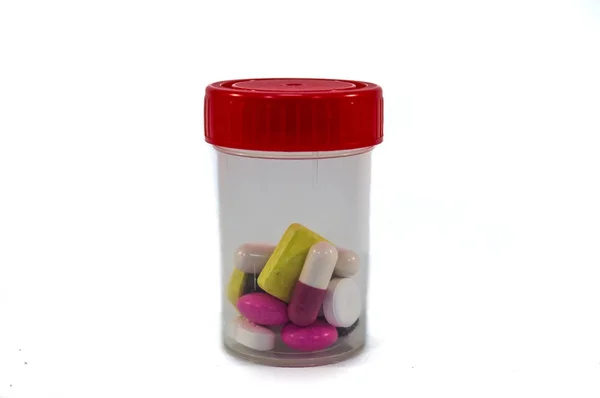 Plastic medicine box with a red lid — Stock Photo, Image