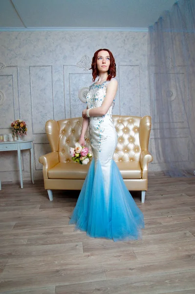 Beautiful young girl in evening dress posing at interior photo s — Stock Photo, Image