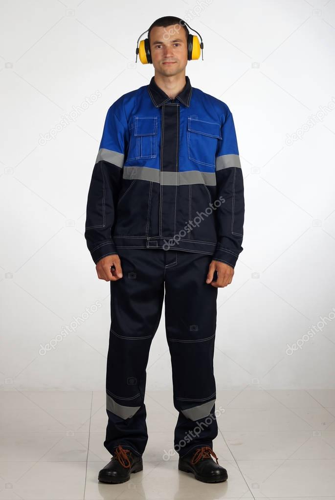 A man in overalls and work wear