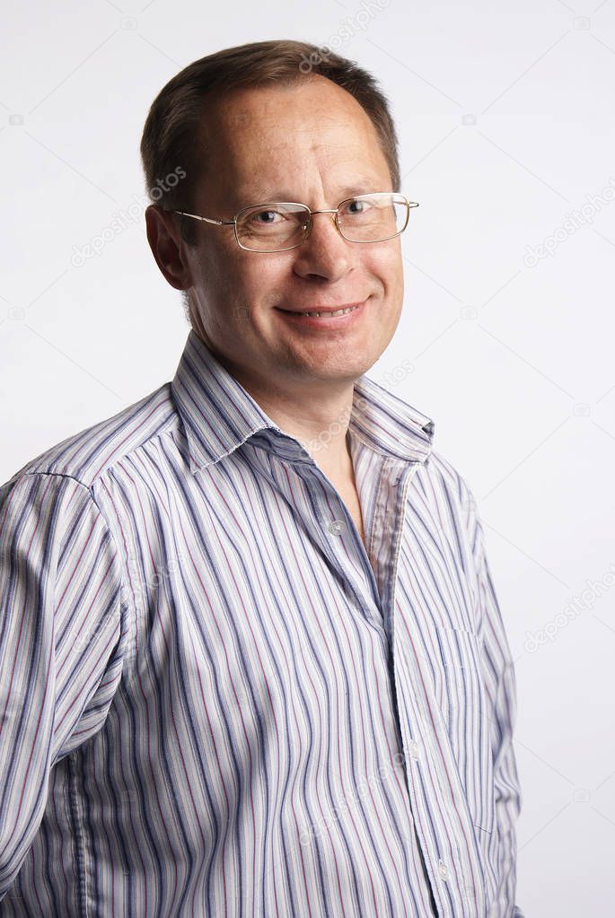 White Man in glasses posing in studio