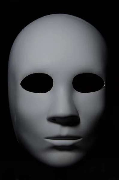 Máscara Blanca Sobre Fondo Negro Imagen De Stock