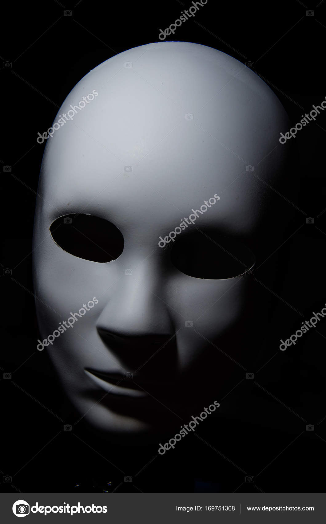 Premium Photo  Expressionless white masks on a black cloth