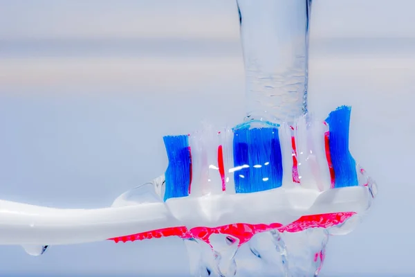 Colorful tooth brush under water. — Stock Photo, Image