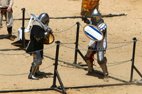 fight of knights on swords in knights' outfit in Israel