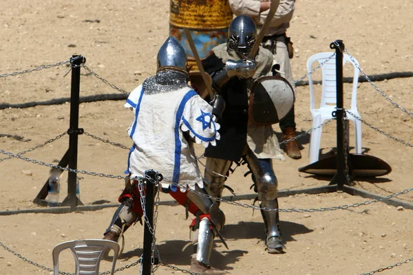 fight of knights on swords in knights\' outfit in Israel