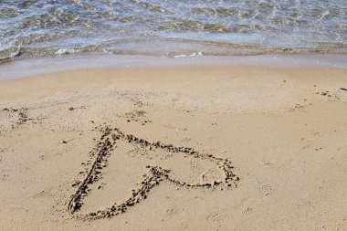 İsrail'in kuzeyinde Akdeniz kıyılarında kum ayak izleri 