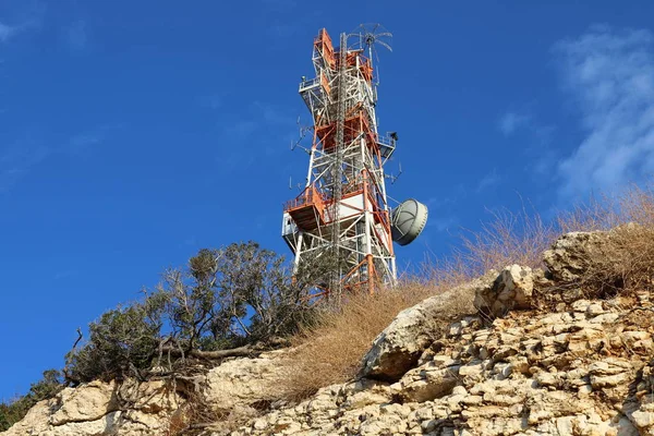 An electric pole with current insulators and wires is installed in northern Israel.