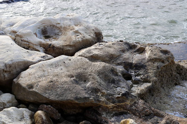 stones lie on the shores of the Mediterranean Sea in the north of the state of Israel 