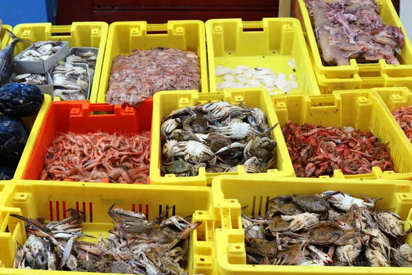 fresh sea fish and crabs are sold in the bazaar in the seaport of Acre in northern Israel