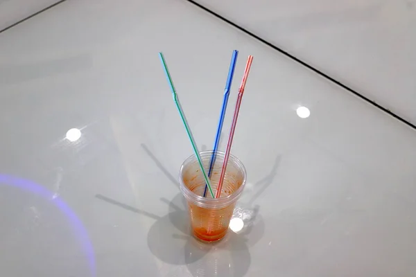 water and other soft and soft drinks are poured in a glass