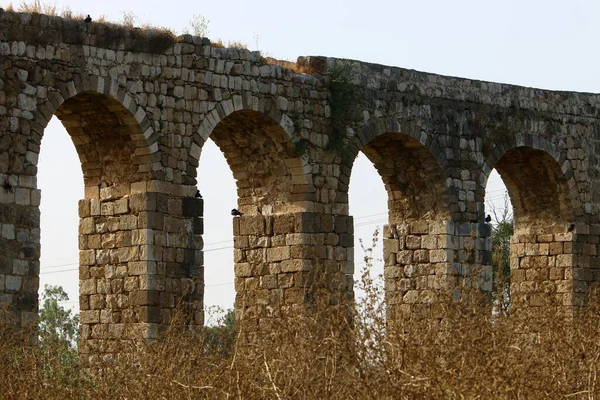 Old stone viaduct in the city of Acre. The system of water supply from sources to the city