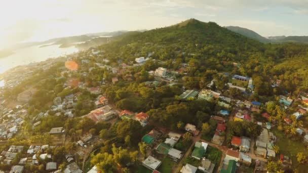 Aerial view Coron city with slums and poor district. Palawan. Busuanga island. Evening time and sunset. Fisheye view.