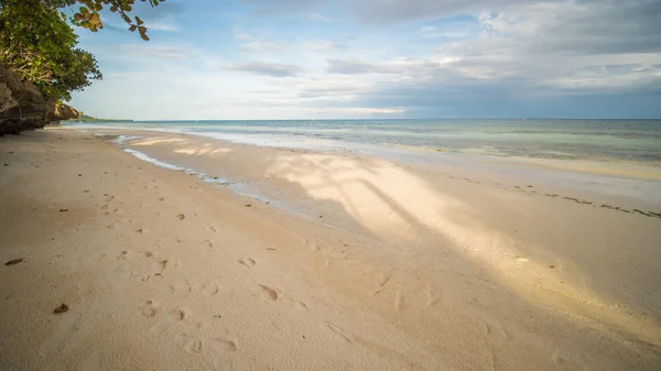 Beautiful gentle nature of the Philippines. The island of Bohol. A beach with sloping cliffs. Anda. Poblacion village.