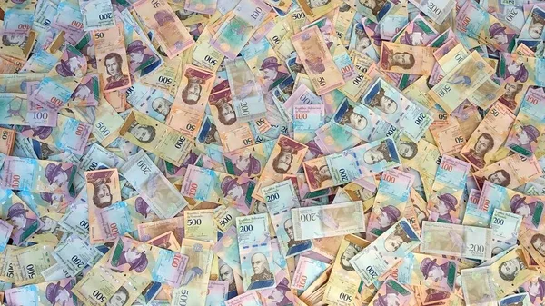 Throwing Venezuelan money on the floor. Venezuella.
