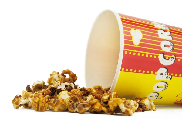 Rozlité popcorn s pohárek — Stock fotografie